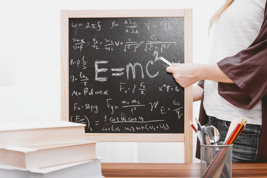 Open mathematics textbook with equations and graphs