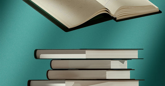 Open book on a stack of books for business reading